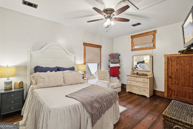 bedroom featuring ceiling fan and dark hardwood / wood-style floors