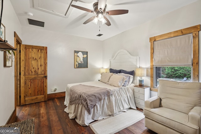 bedroom with ceiling fan and dark hardwood / wood-style floors