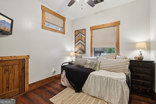 bedroom featuring ceiling fan and dark wood-type flooring