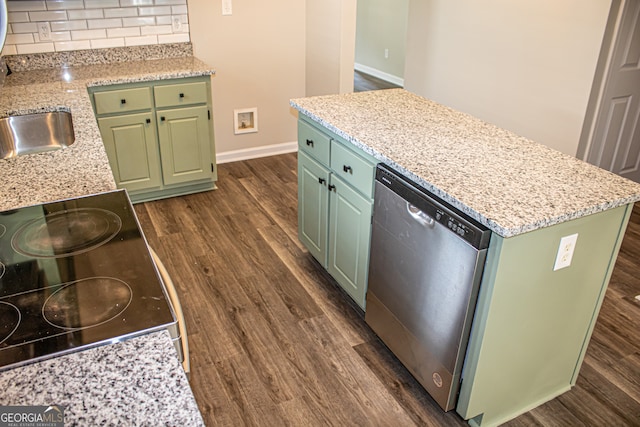 kitchen with decorative backsplash, dishwasher, green cabinets, and dark hardwood / wood-style flooring