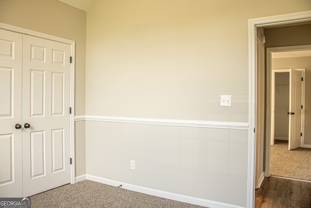 empty room featuring dark hardwood / wood-style flooring