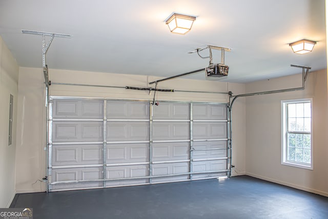 garage featuring electric panel and a garage door opener