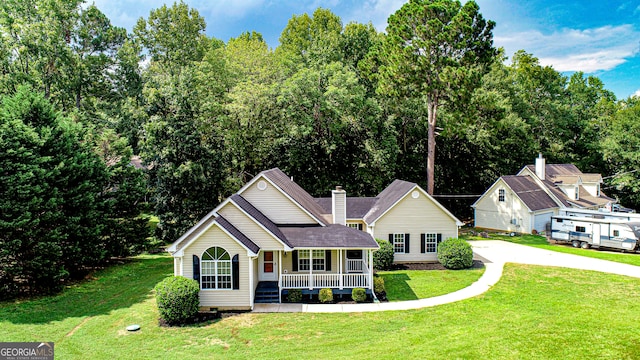 view of front of property with a front yard and a porch