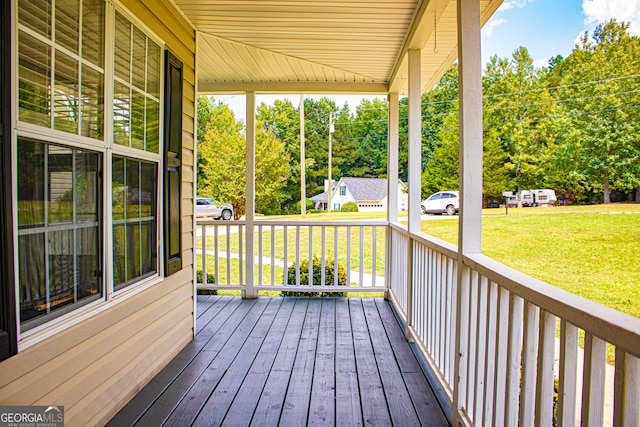 wooden deck with a yard