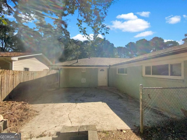 view of side of property featuring a patio area