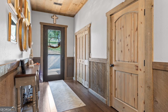 foyer entrance with wooden ceiling and dark wood-type flooring