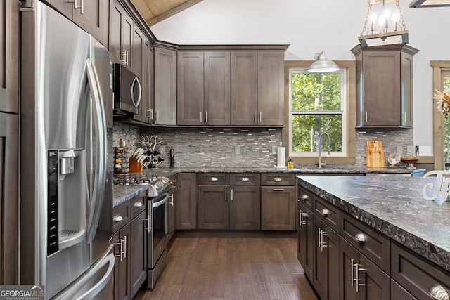 kitchen featuring dark wood-type flooring, backsplash, stainless steel appliances, dark brown cabinetry, and sink