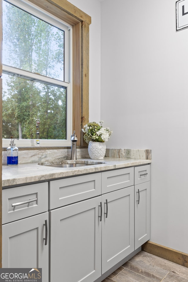 bathroom featuring vanity and hardwood / wood-style flooring