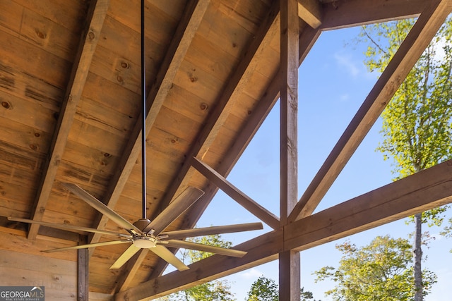 exterior details featuring wood ceiling, ceiling fan, and beamed ceiling