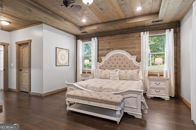 bedroom with multiple windows, wooden ceiling, and dark hardwood / wood-style flooring