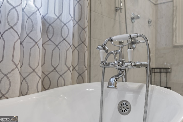 details featuring sink and a tub