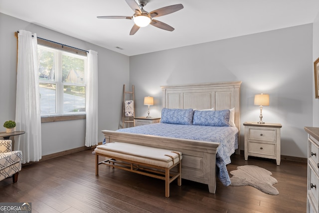 bedroom featuring ceiling fan and dark hardwood / wood-style flooring