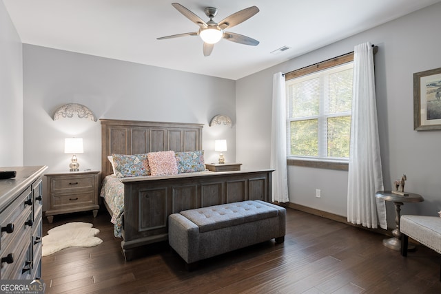 bedroom featuring ceiling fan and dark hardwood / wood-style floors