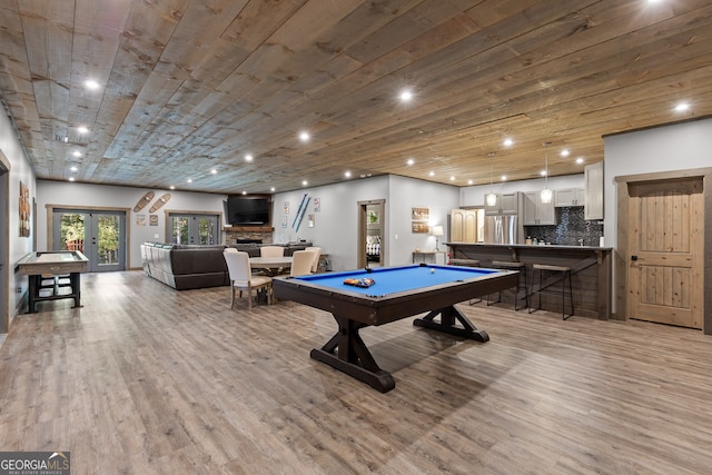 game room with wood ceiling, bar, light hardwood / wood-style flooring, billiards, and french doors