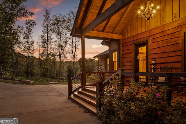 view of exterior entry at dusk