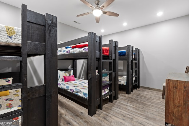 bedroom featuring hardwood / wood-style floors and ceiling fan