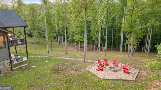 view of yard featuring a patio area and an outdoor fire pit