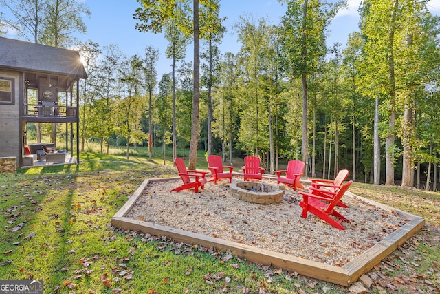 view of yard with a patio area and an outdoor fire pit