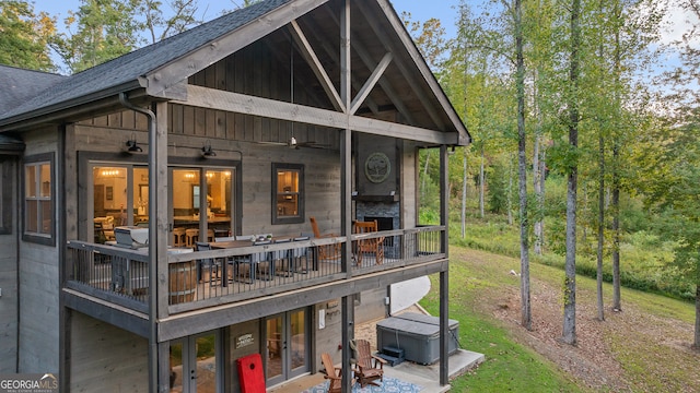 rear view of house with ceiling fan