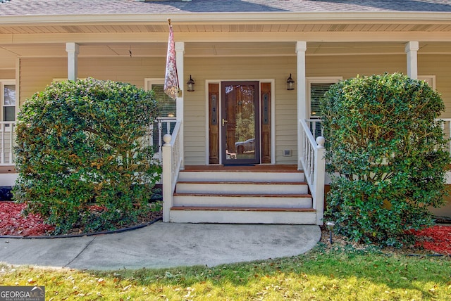 doorway to property featuring covered porch