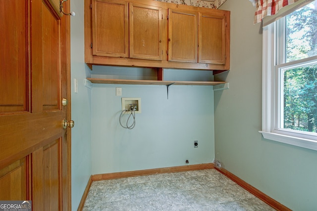 laundry room with washer hookup, cabinets, and hookup for an electric dryer