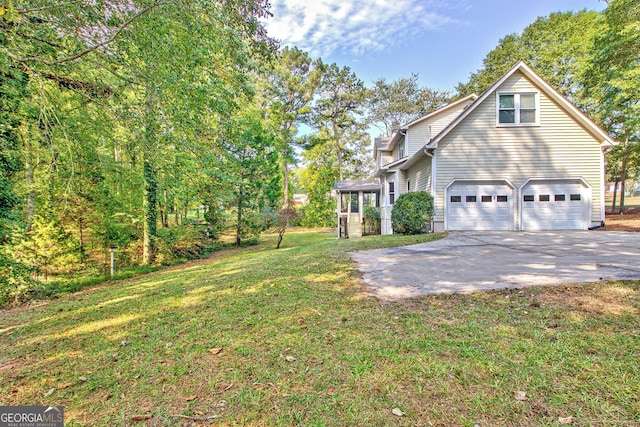 view of home's exterior featuring a garage and a yard