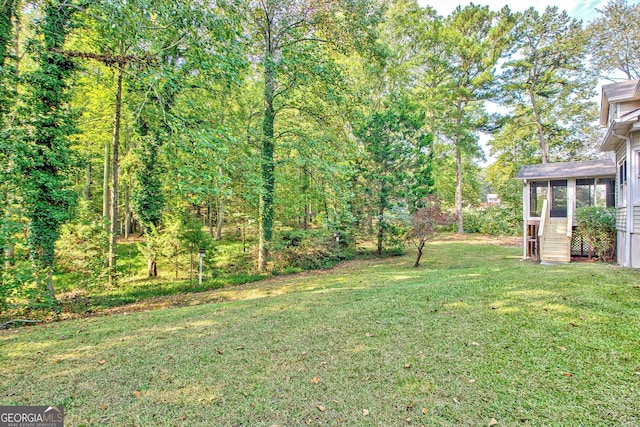 view of yard featuring a sunroom