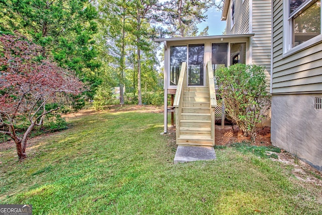 view of yard featuring a sunroom