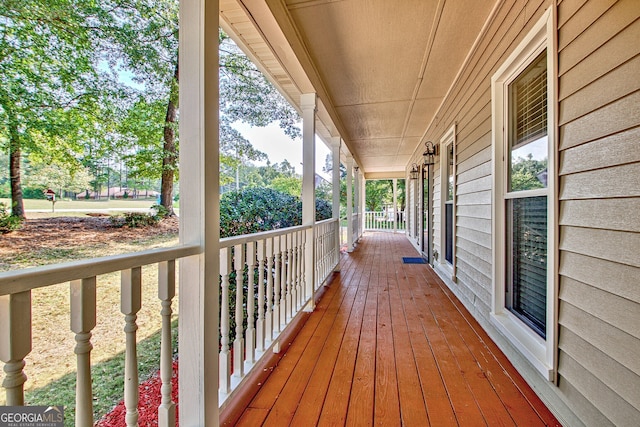 wooden terrace featuring a porch