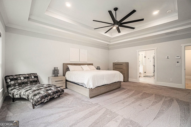 bedroom with a raised ceiling, ornamental molding, carpet, and ceiling fan