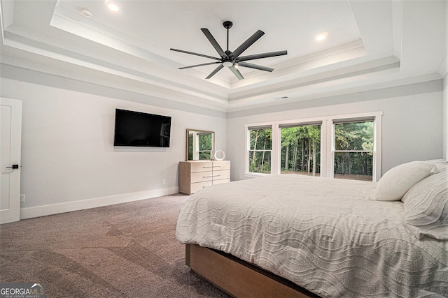 bedroom featuring crown molding, ceiling fan, carpet, and a raised ceiling