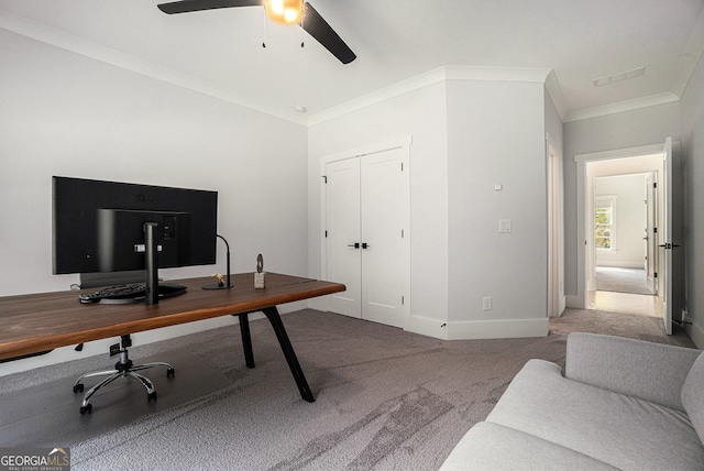 office featuring ceiling fan, crown molding, and carpet flooring