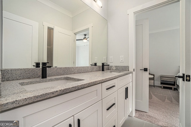 bathroom with ceiling fan, vanity, and crown molding