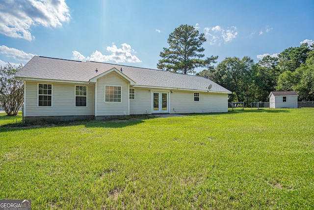 back of house featuring a yard