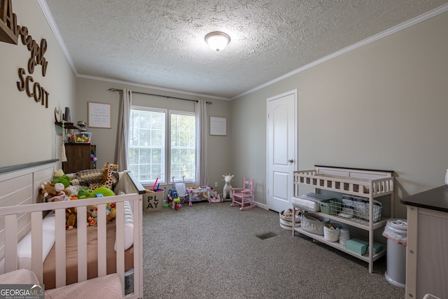 bedroom with a textured ceiling, carpet, crown molding, and a nursery area