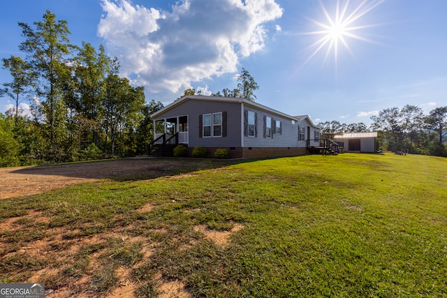 view of front of home featuring cooling unit and a front lawn