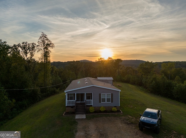 view of front of home with a yard