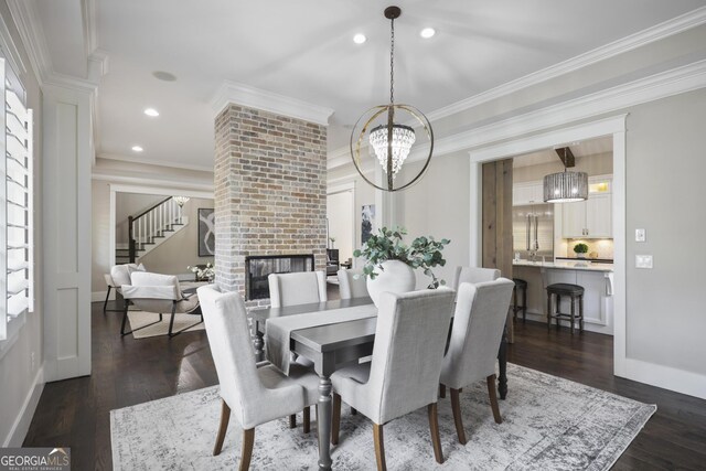 kitchen featuring premium appliances, hanging light fixtures, lofted ceiling with beams, and a healthy amount of sunlight