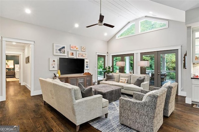 living room featuring dark hardwood / wood-style floors, ceiling fan, french doors, and high vaulted ceiling