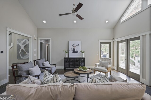 sunroom featuring wood ceiling, a wealth of natural light, ceiling fan, and a brick fireplace