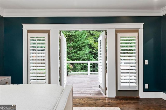 bedroom featuring dark wood-type flooring and crown molding