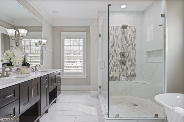 bathroom featuring ornamental molding, vanity, an inviting chandelier, and a shower with shower door