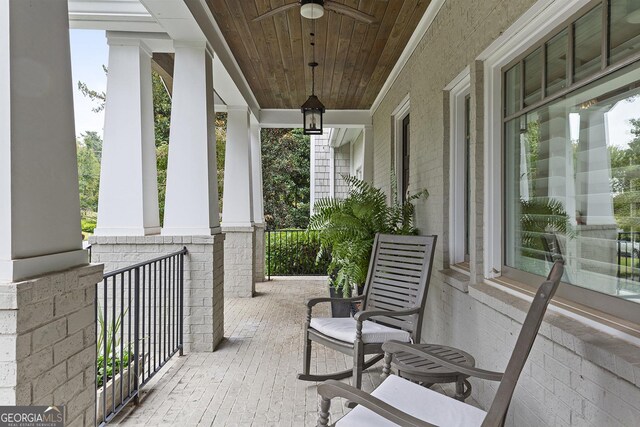 view of patio featuring ceiling fan and a porch