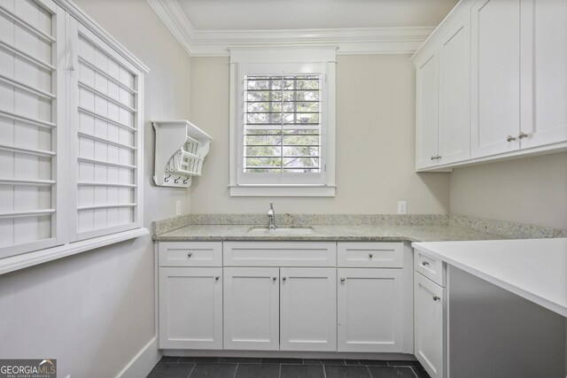 full bathroom with tile patterned floors, ornamental molding, vanity, tiled shower / bath, and toilet