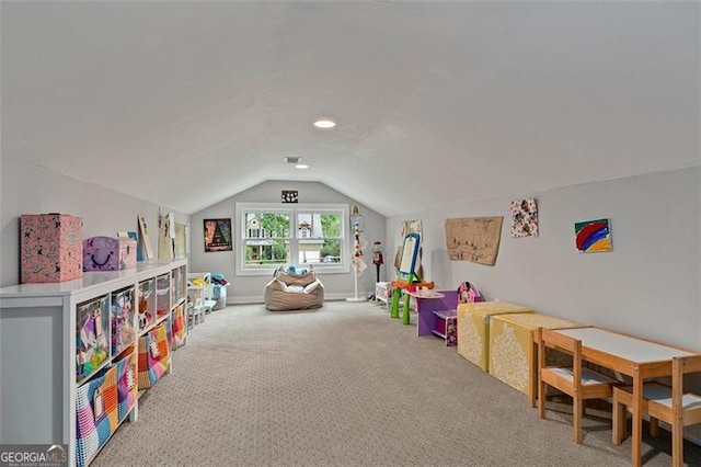 rec room featuring vaulted ceiling and carpet flooring