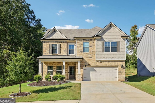 craftsman house featuring a front yard and a garage