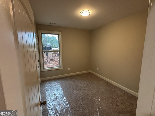5544 Whispering Swan Ct, Douglasville, GA 30135 - carpeted empty room with baseboards