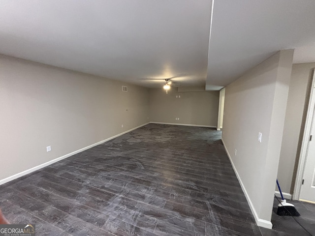 5544 Whispering Swan Ct, Douglasville, GA 30135 - finished below grade area featuring dark wood-style flooring and baseboards