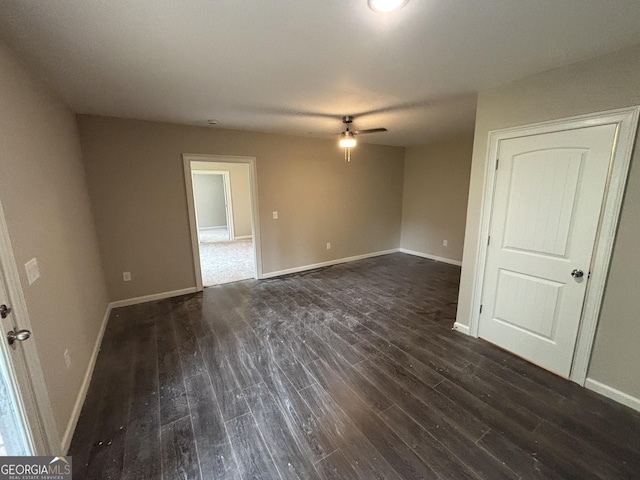 5544 Whispering Swan Ct, Douglasville, GA 30135 - spare room featuring ceiling fan, dark wood-style flooring, and baseboards