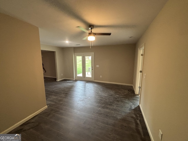 5544 Whispering Swan Ct, Douglasville, GA 30135 - empty room featuring a ceiling fan, baseboards, and dark wood-style floors